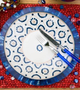 Plates used to set 4th of July table. Elle Decor Magazine. 